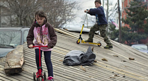 kids riding scooters