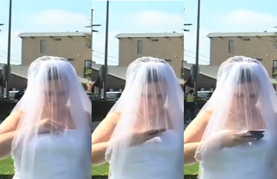 bride on phone during wedding