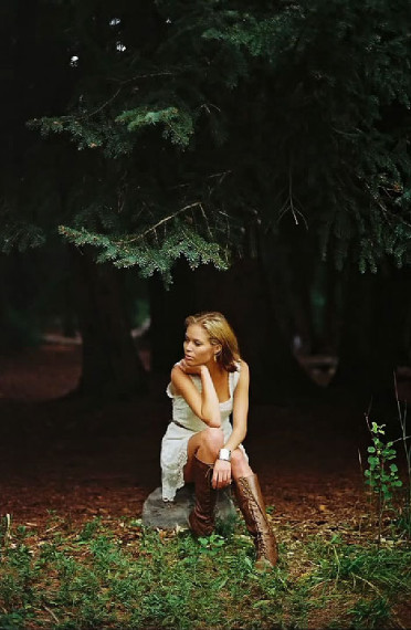 Photo of a young woman sitting 