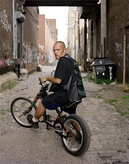 guy riding bike in detroit