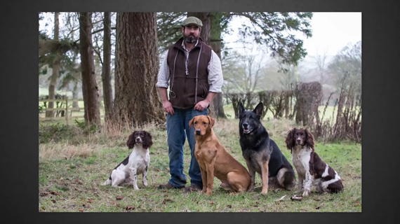 group photograph of dogs with owner