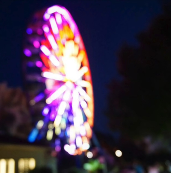 out of focus image of a ferris wheel