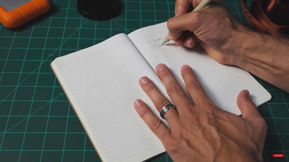 taking notes in a notebook