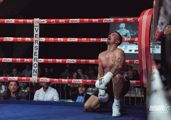 kneeling boxer with funny expression